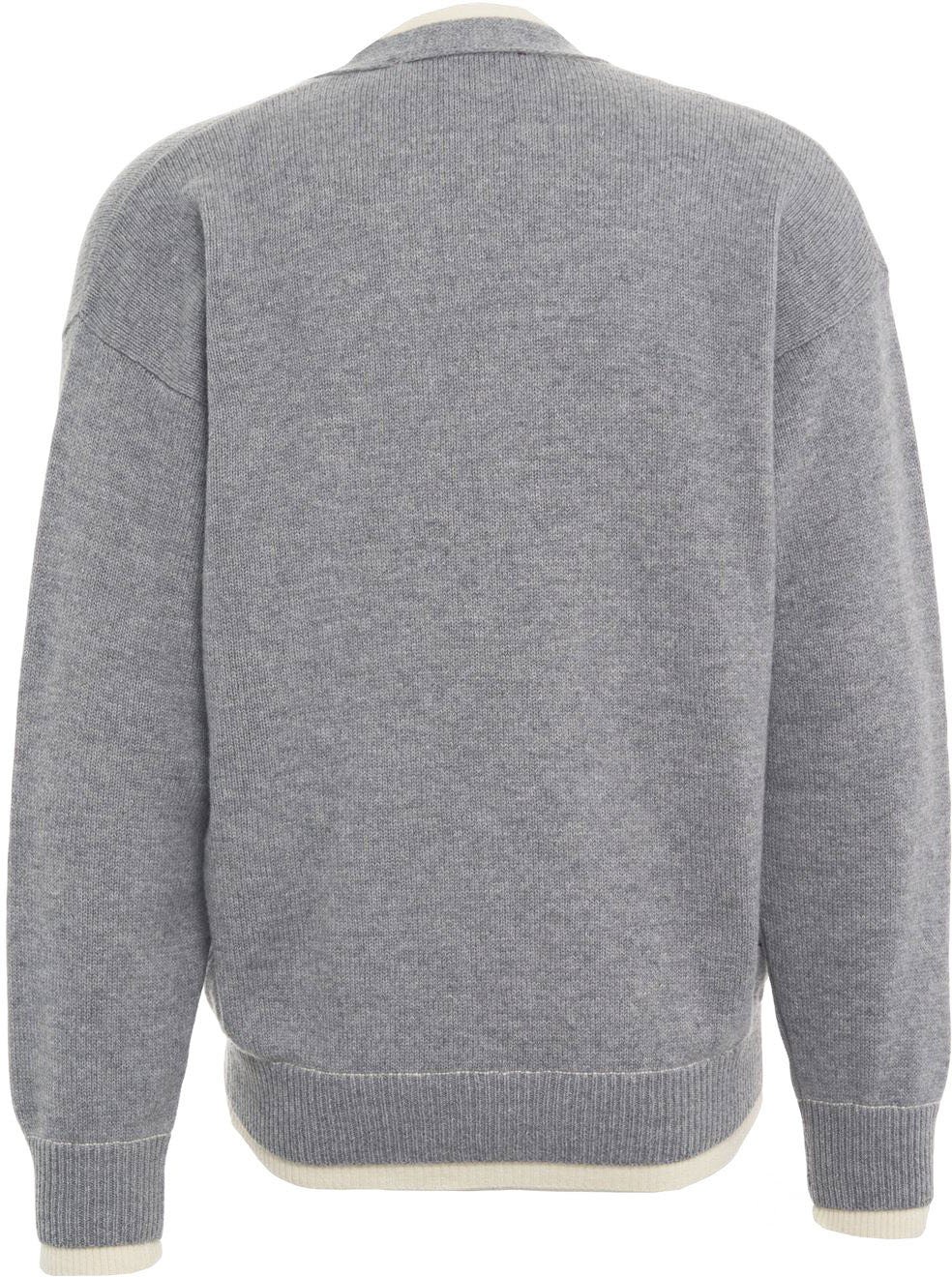 Cardigan with hidden button closure