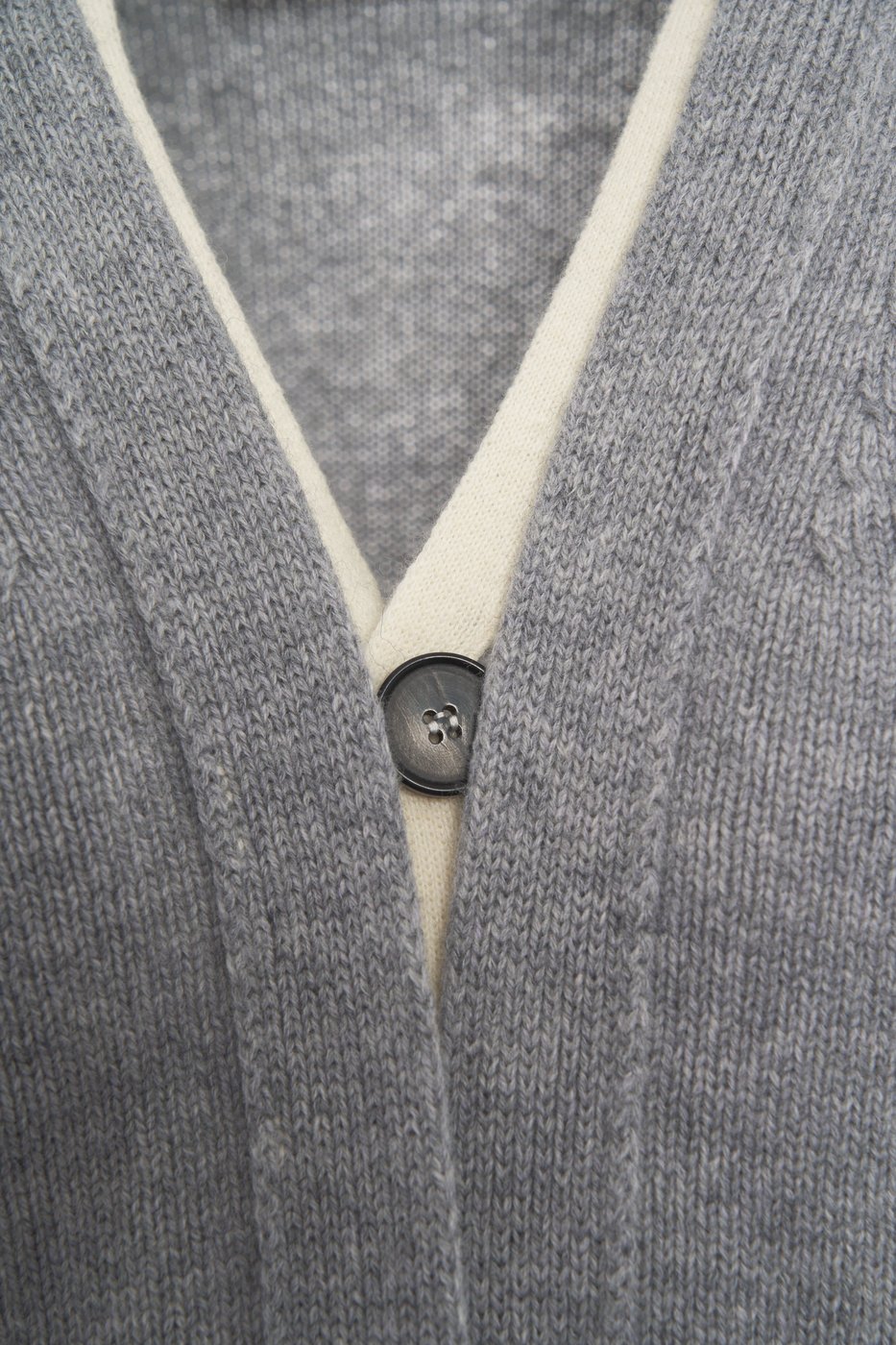 Cardigan with hidden button closure