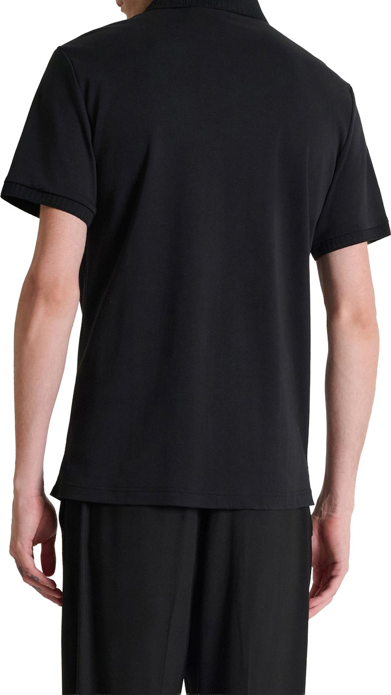 Black regular-fit polo in cotton jersey with plate