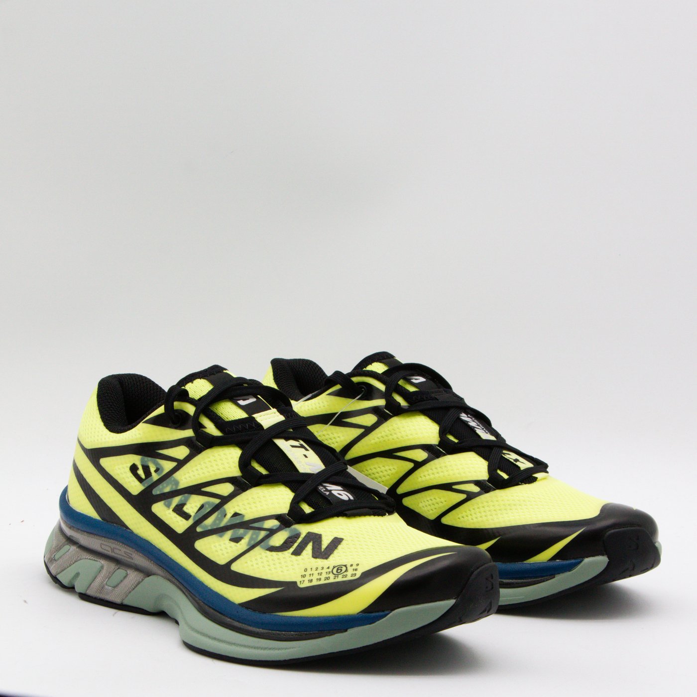 Neon Yellow Mesh Sneakers With Geometric Overlays