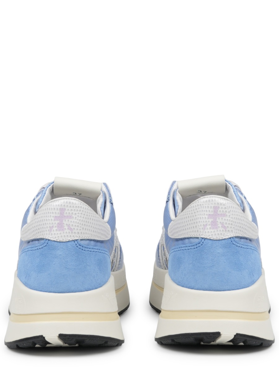 Soft Blue Sneakers with Distinctive Logo and Contrasting Outsole