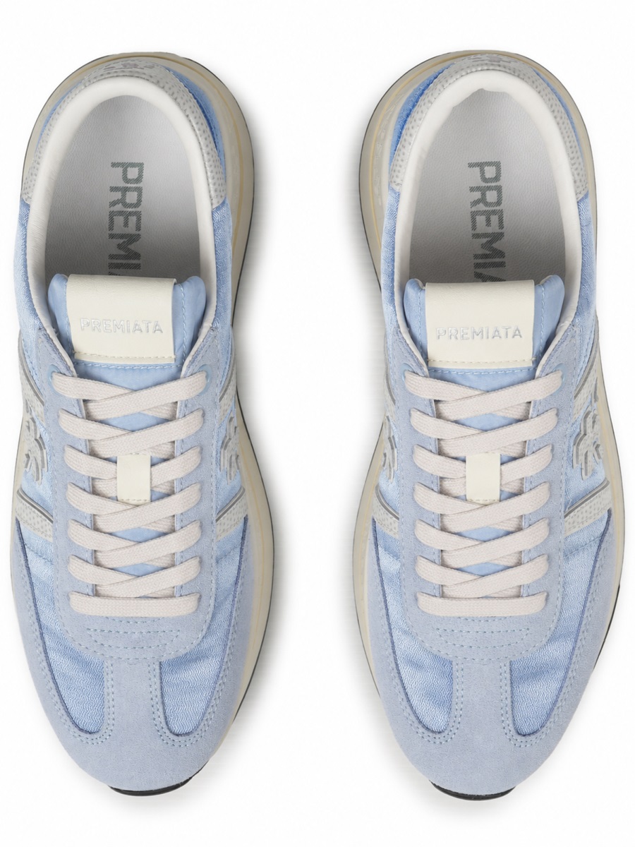 Soft Blue Sneakers with Distinctive Logo and Contrasting Outsole