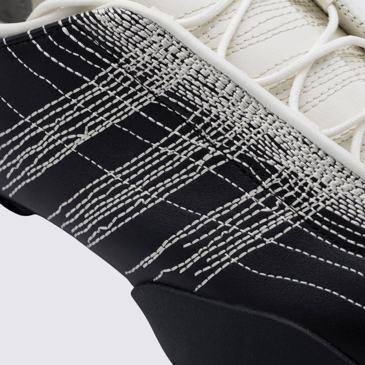 Low-Profile Sneakers with Textured Stitching and Signature Detail